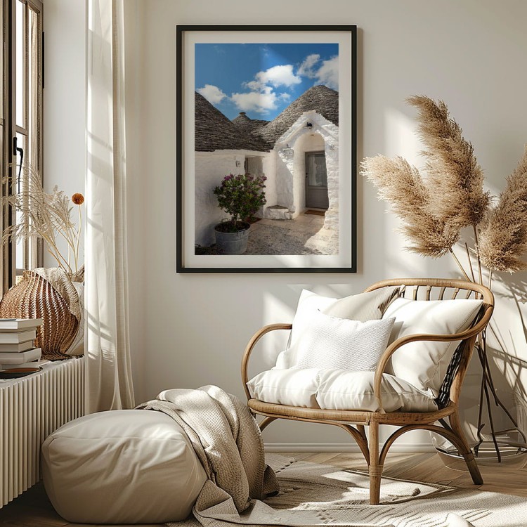 plakat alberobello białe trulli z białym obramowaniem w salonie