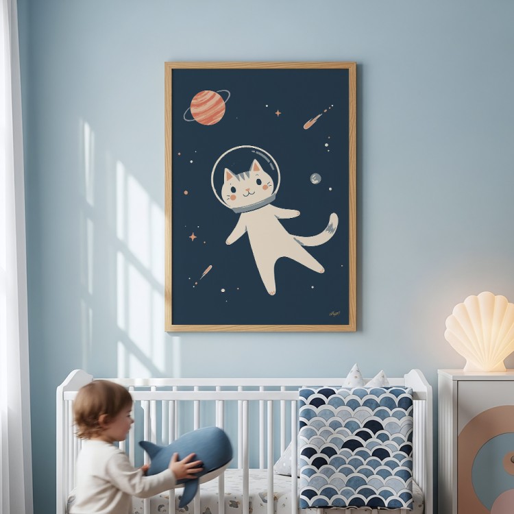 plakat kot w kosmosie na ścianie w drewnianej ramce