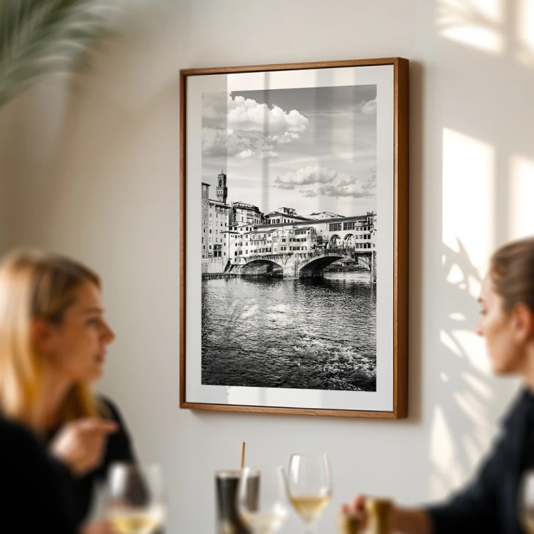 plakat florencjamost złotników nad arno w czerni i bieli z białym obramowaniem w restauracji